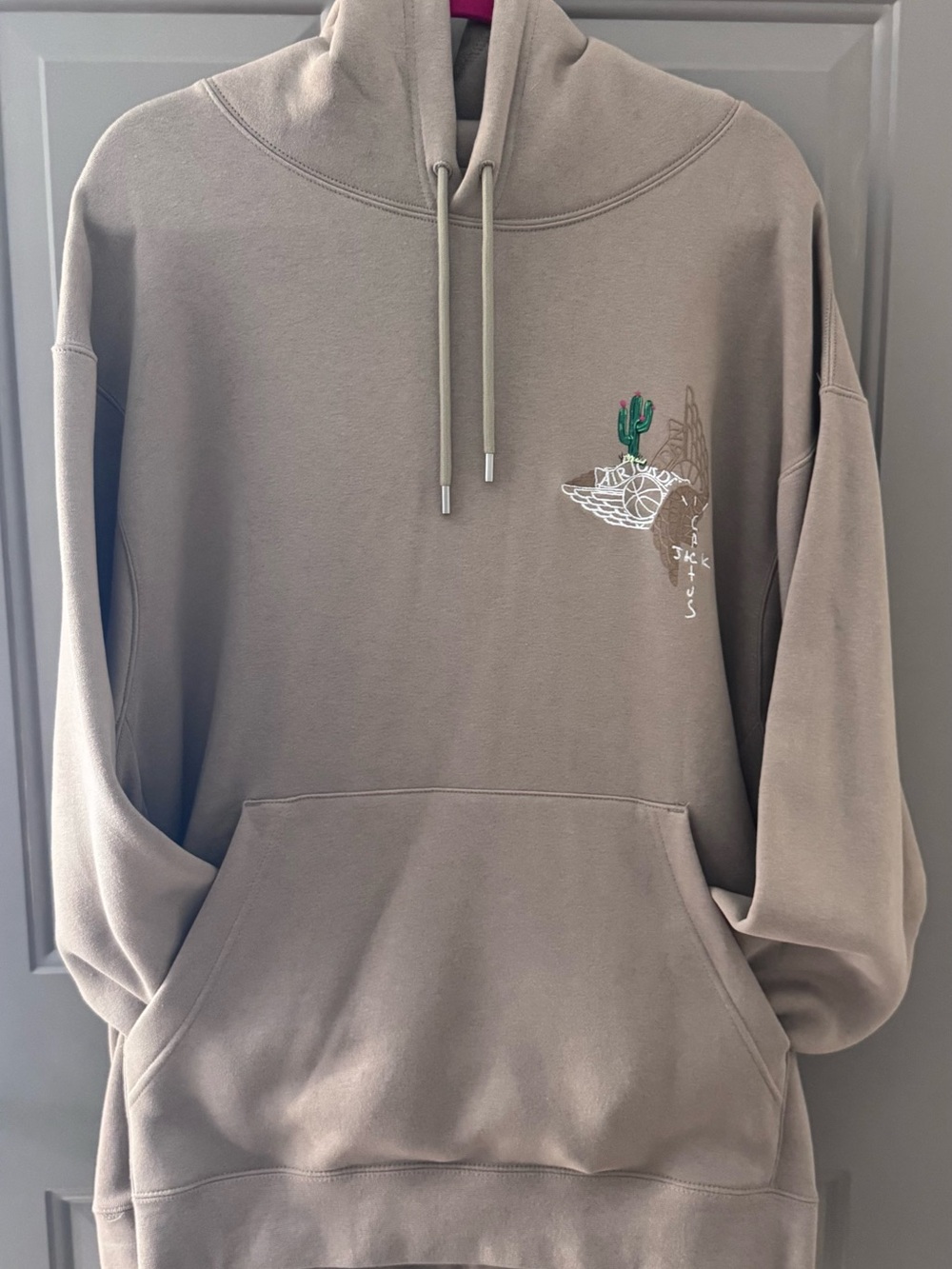Travis Scott Cactus Jack x Jordan Pullover Hoodie in the Khaki colorway.